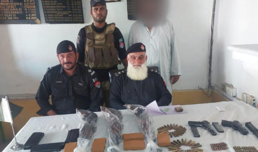 Arms smuggler held with cache of weapons
