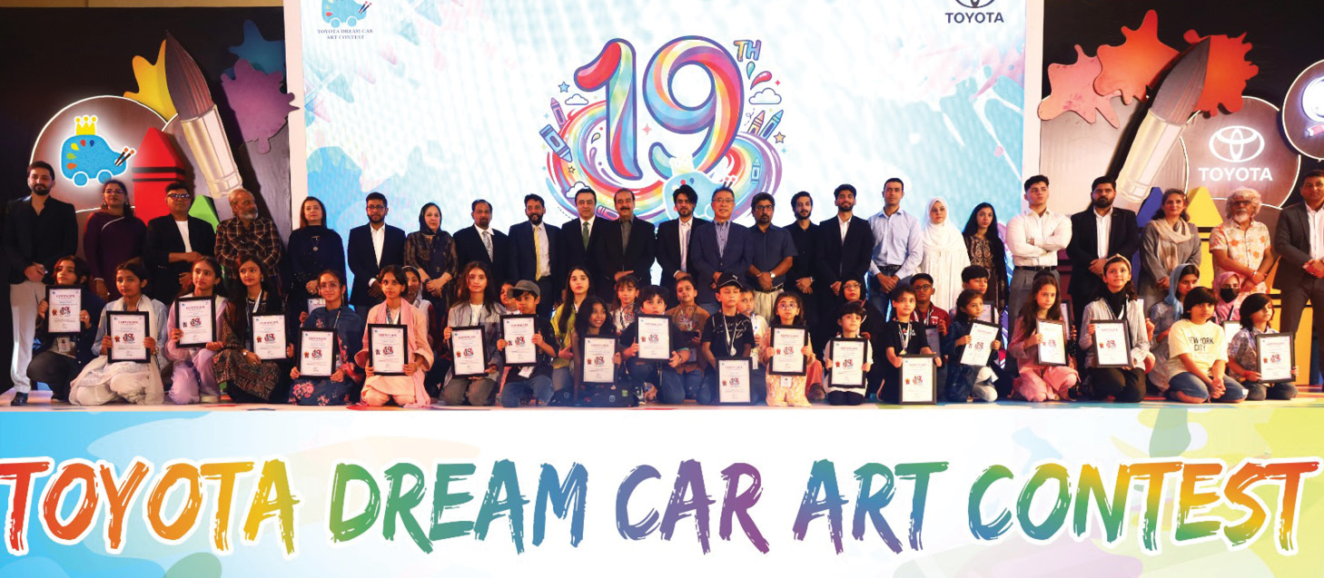 Young Pakistani artists celebrating their victory at the Dream Car Art Contest