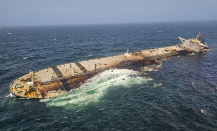 The damaged and half sunk oil tanker Caroline Bezengi, at sea off the coast of Oman